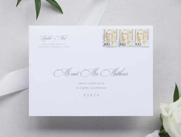 wedding envelope witg guest address and couple address on the top left of the envelope. texts are in green