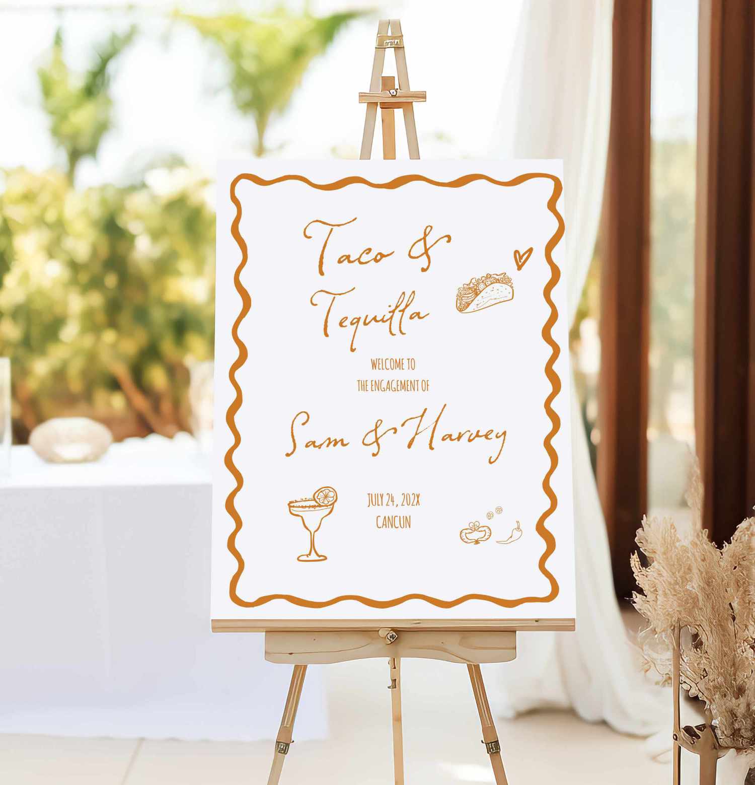 hand drawn fiesta theme welcome sign with orange text on white foam board near the restautent door