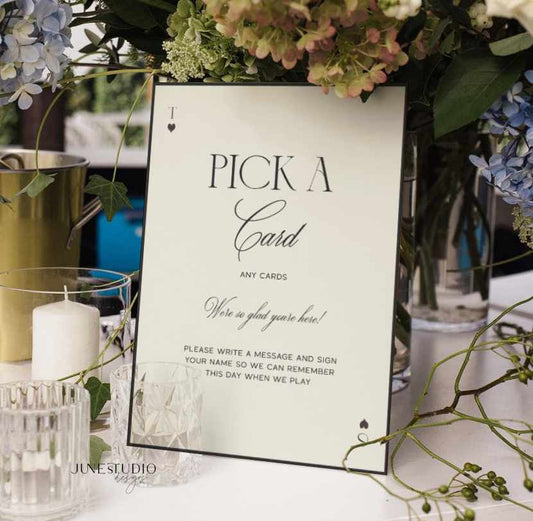 wedding table sign with text Pick A Card in black and off-white background sign