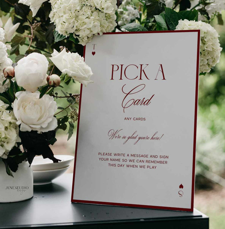 retro style wedding table sign with text Pick A Card in red and off-white background sign