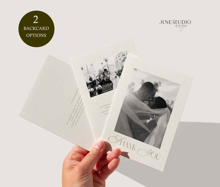 A hand holds three wedding thank-you postcards against a light beige background. One card is shown front-facing with a black-and-white wedding photo and the words 'THANK YOU' in elegant script, while the other two cards are fanned behind it to show the plain back.