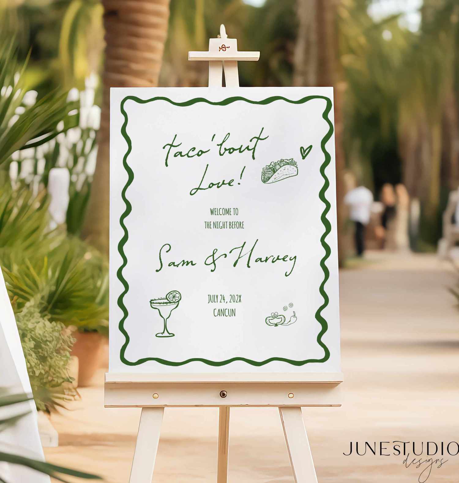 hand drawn Taco bout love welcome sign with green text on white foam board tropical restaurant background