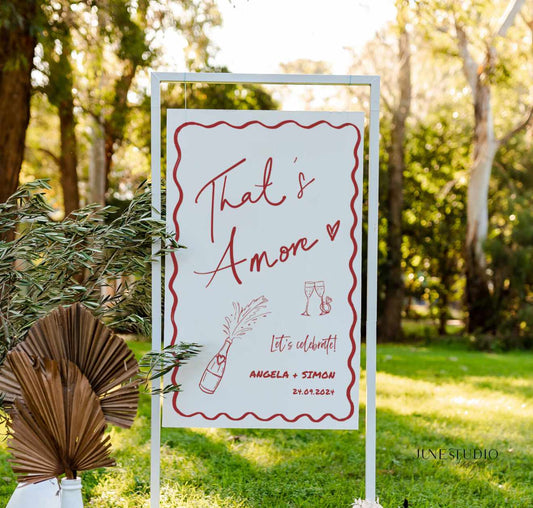 this engagement welcome sign features our original hand drawn champagne bottle and glasses illustration, with engagement ring and wavy border