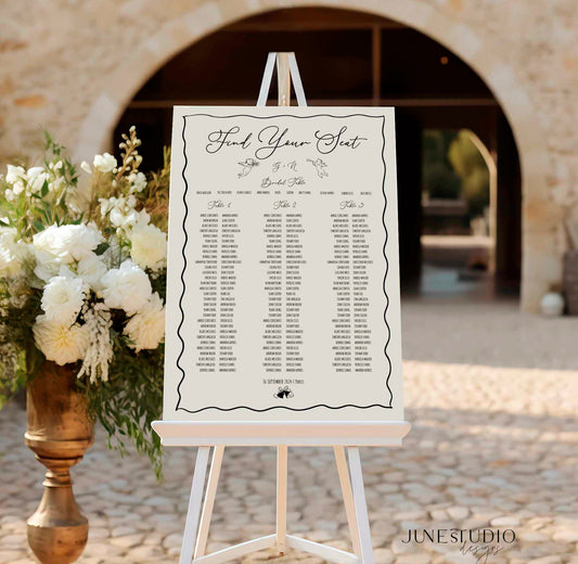 whimsical hand-drawn wedding seating chart digital template featuring angels, wedding bells, and bows